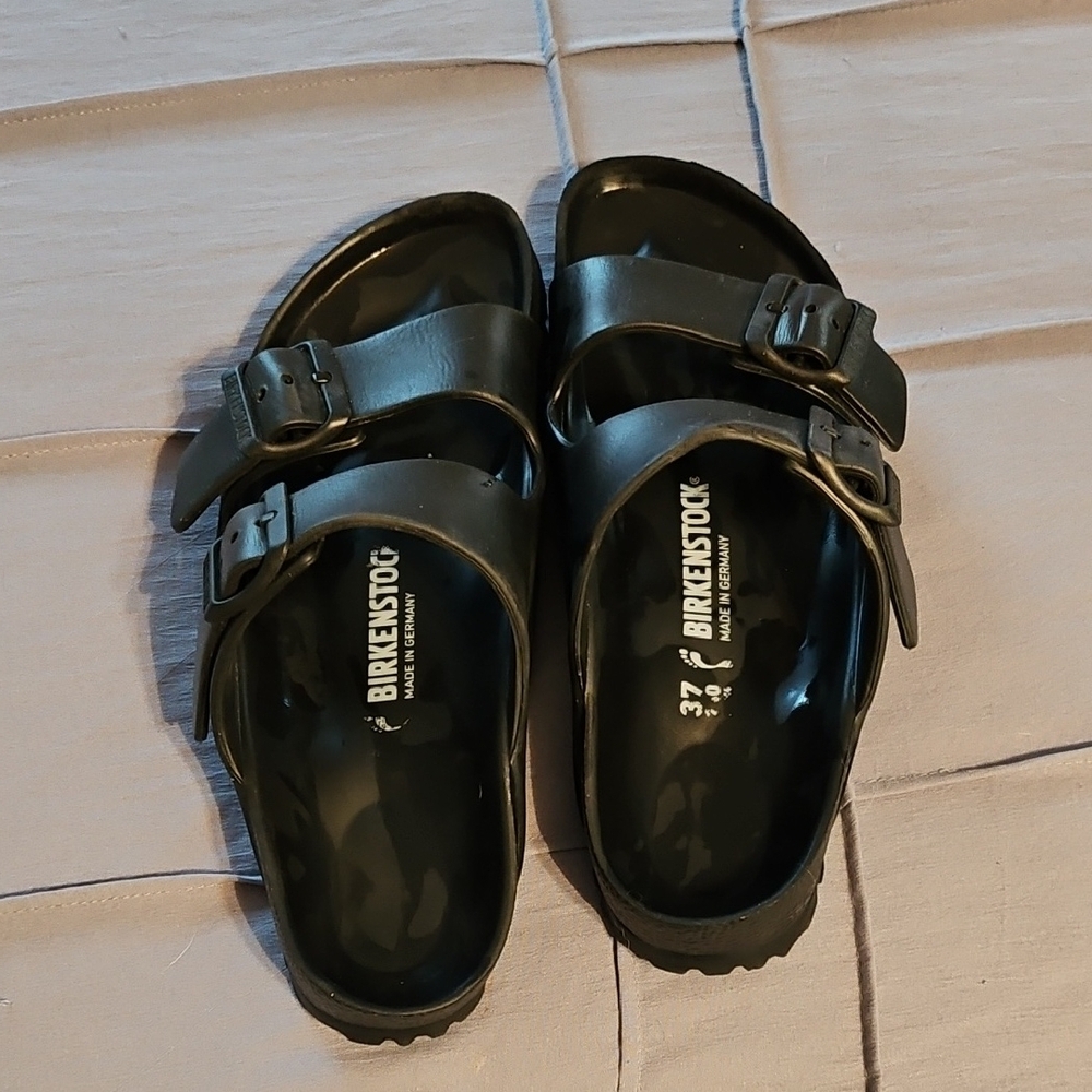 Birkenstock Black Sandals with Glossy Finish and Adjustable Buckles